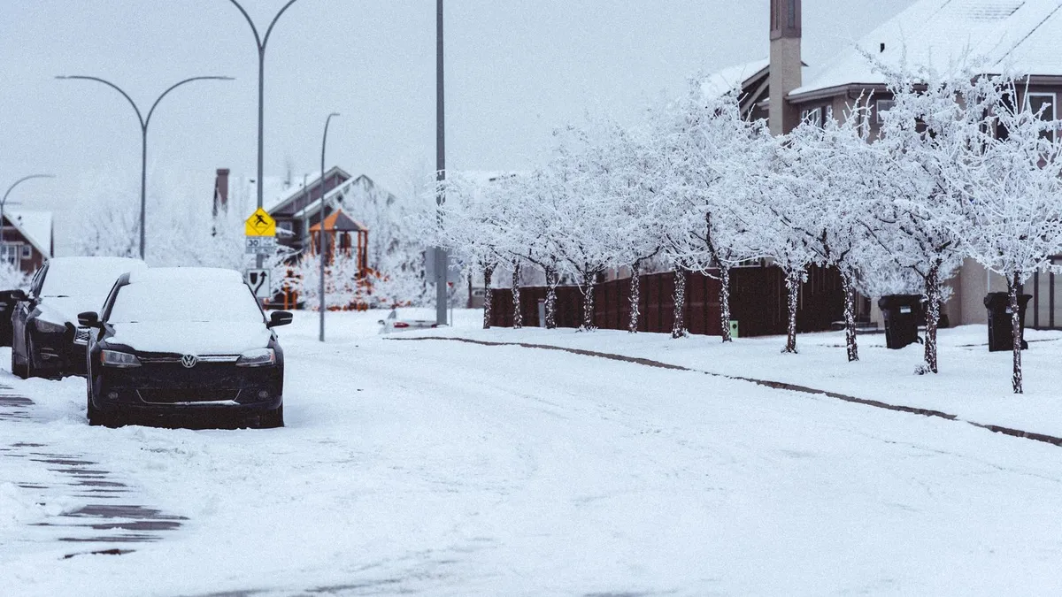Snow covered residential street in Saskatoon in deep winter, when vehicle and heating repairs drive most short loans